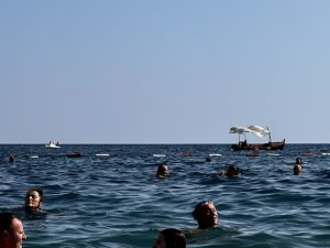 peoples heads sticking out of seawater